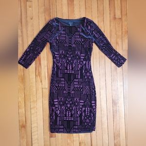 Purple and with velvet detailing, size XS
